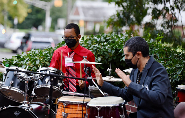 Student and teaching artist perform a percussion piece