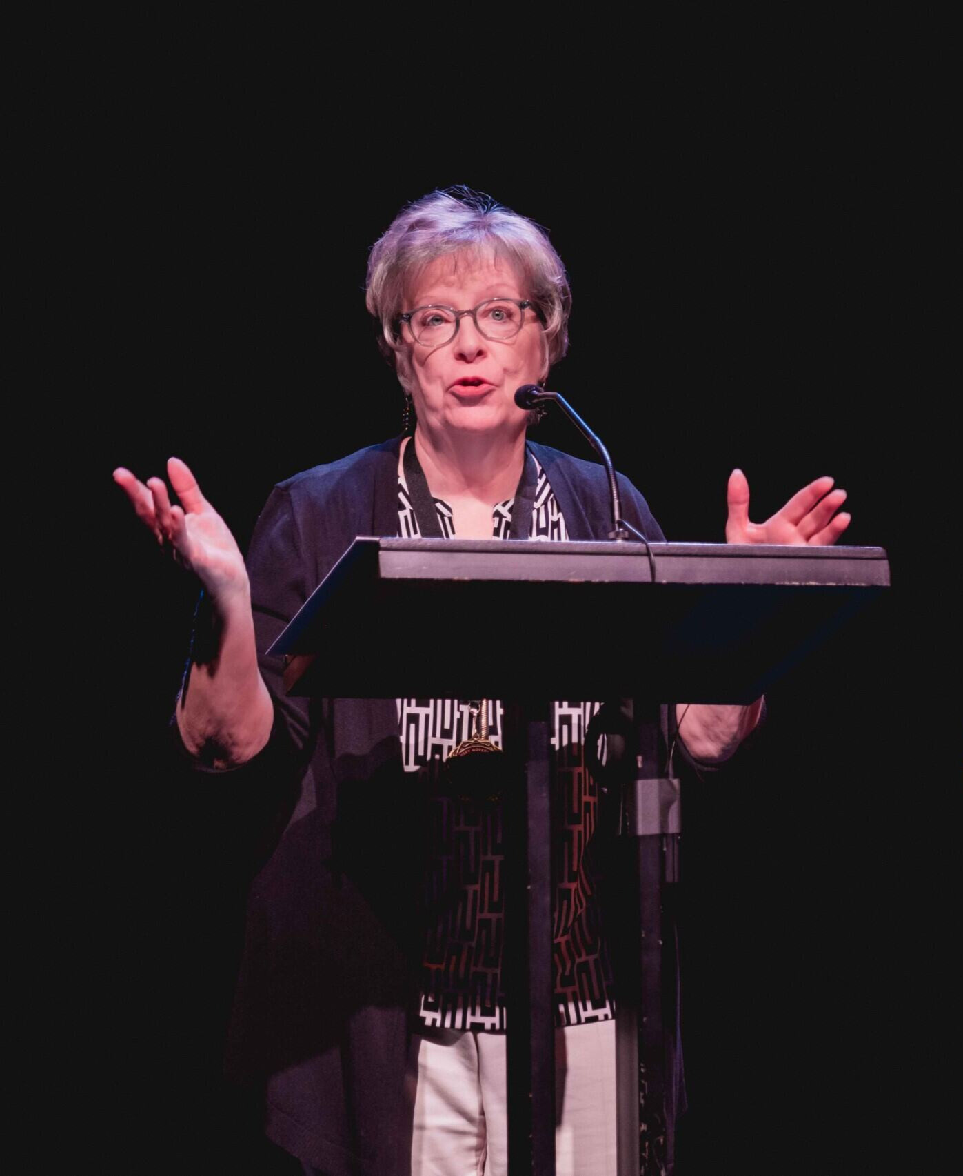 Ann Marie Miller talking in front of a crowd